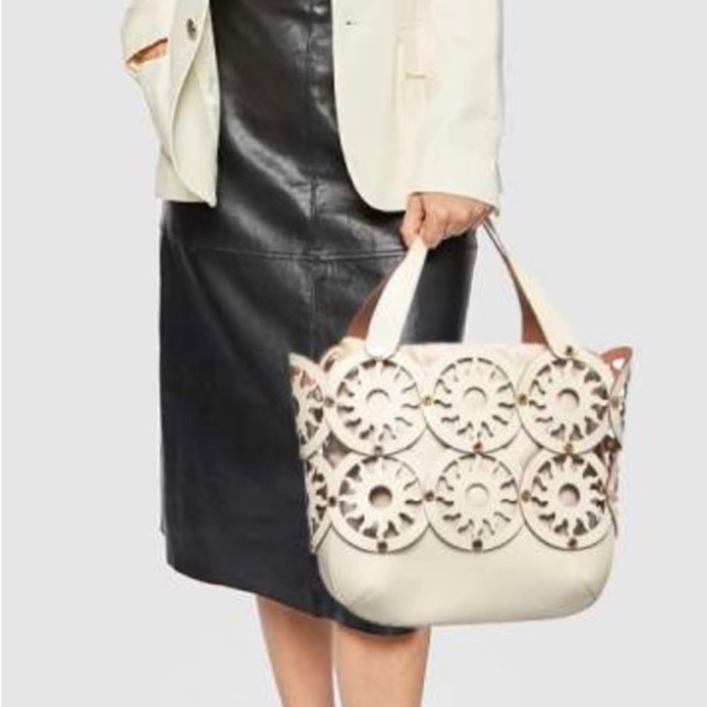 Bvlgari laser cut creme bag with gold hardware